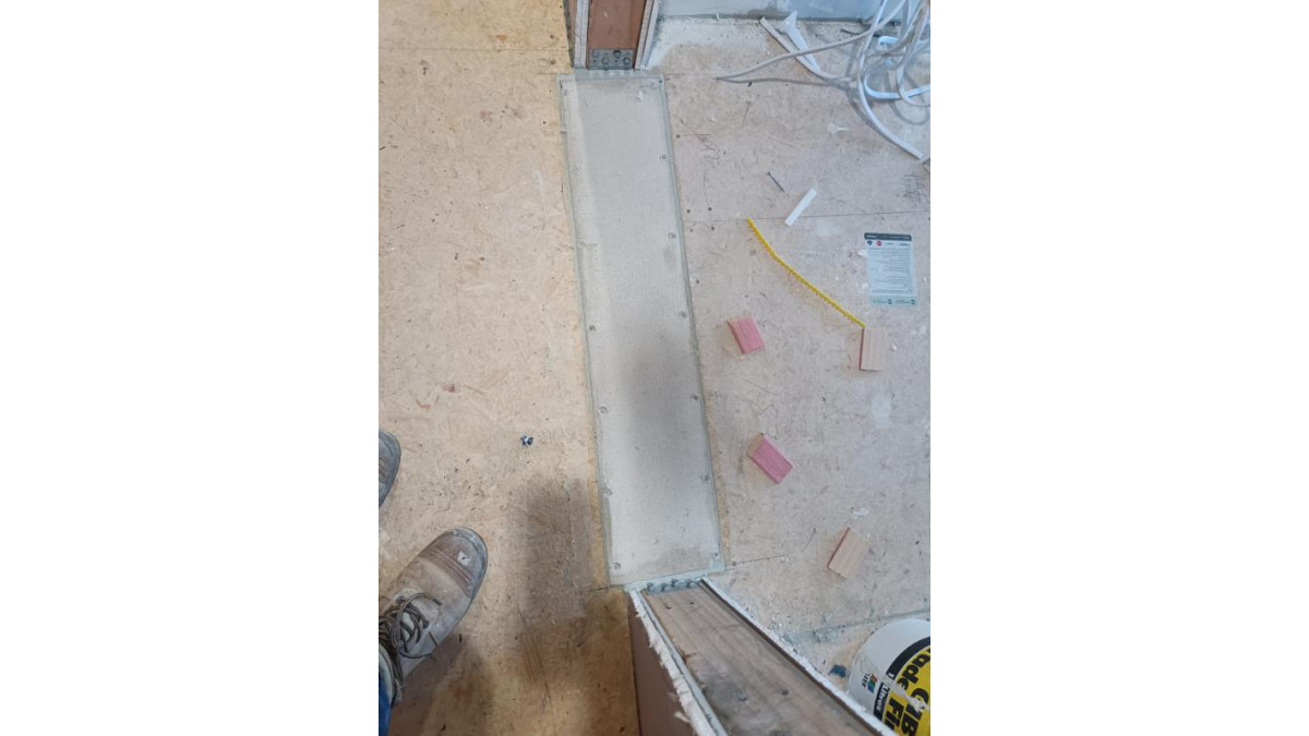 SoundDown In-Floor Fire Stop Battens maintain the continuity of the firecell at fire door thresholds.