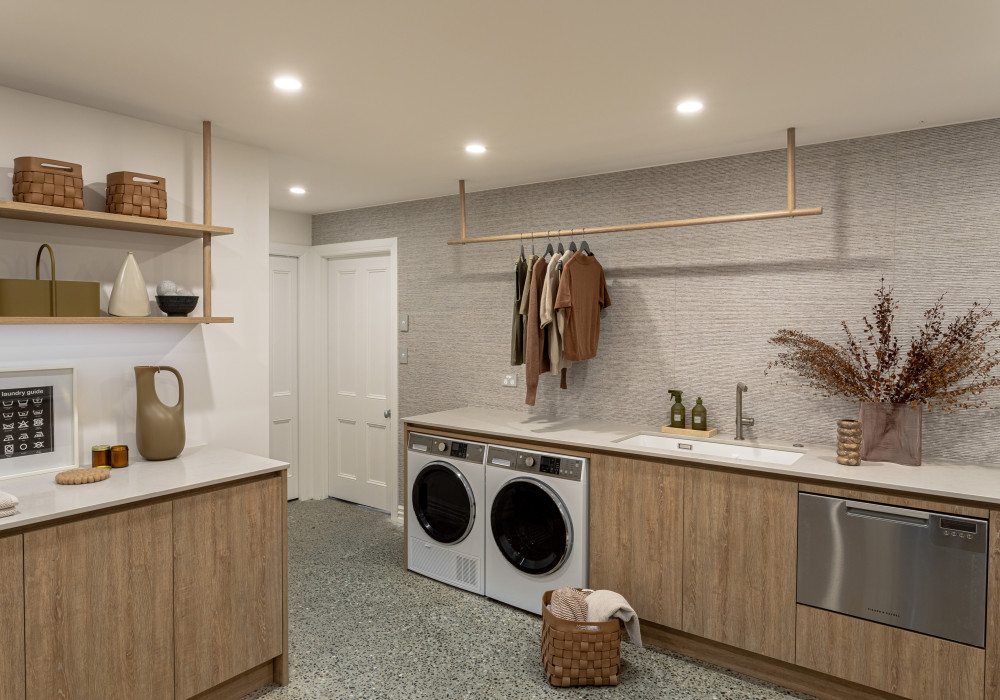 A Basement Laundry Designed to Disappear by Du Bois Design