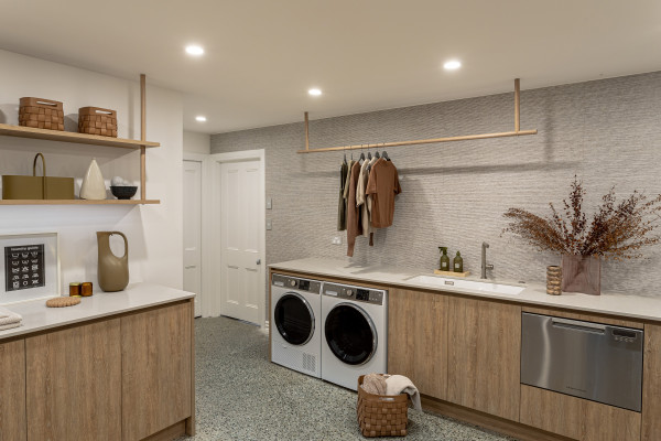 A Basement Laundry Designed to Disappear by Du Bois Design