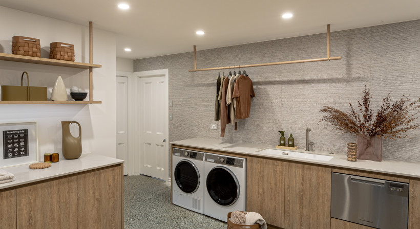A Basement Laundry Designed to Disappear by Du Bois Design