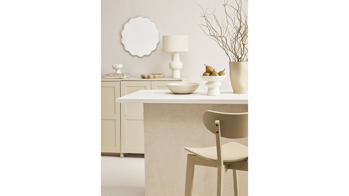 This beige and cream tonal kitchen features walls in Resene Lustacryl Kitchen and Bathroom interior semi-gloss waterborne enamel tinted to Quarter Blanc; island counter in Blanc; island front painted in Resene Sandtex tinted to Triple Blanc; upcycled cabinets in Sisal; Bar Stool Chair from Nood in Triple Sisal. <br />
<br />
Stylist: Vanessa Nouwens. <br />
Photography: Wendy Fenwick.