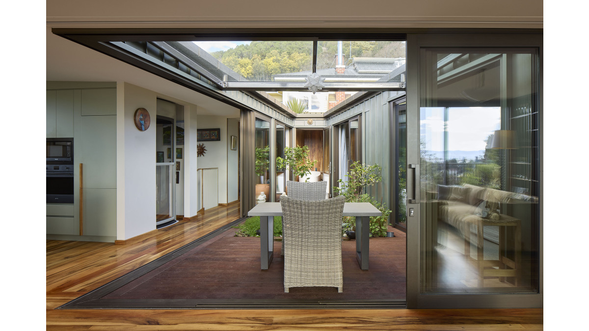 A tilted rooflight lets rain trickle into the gardens.