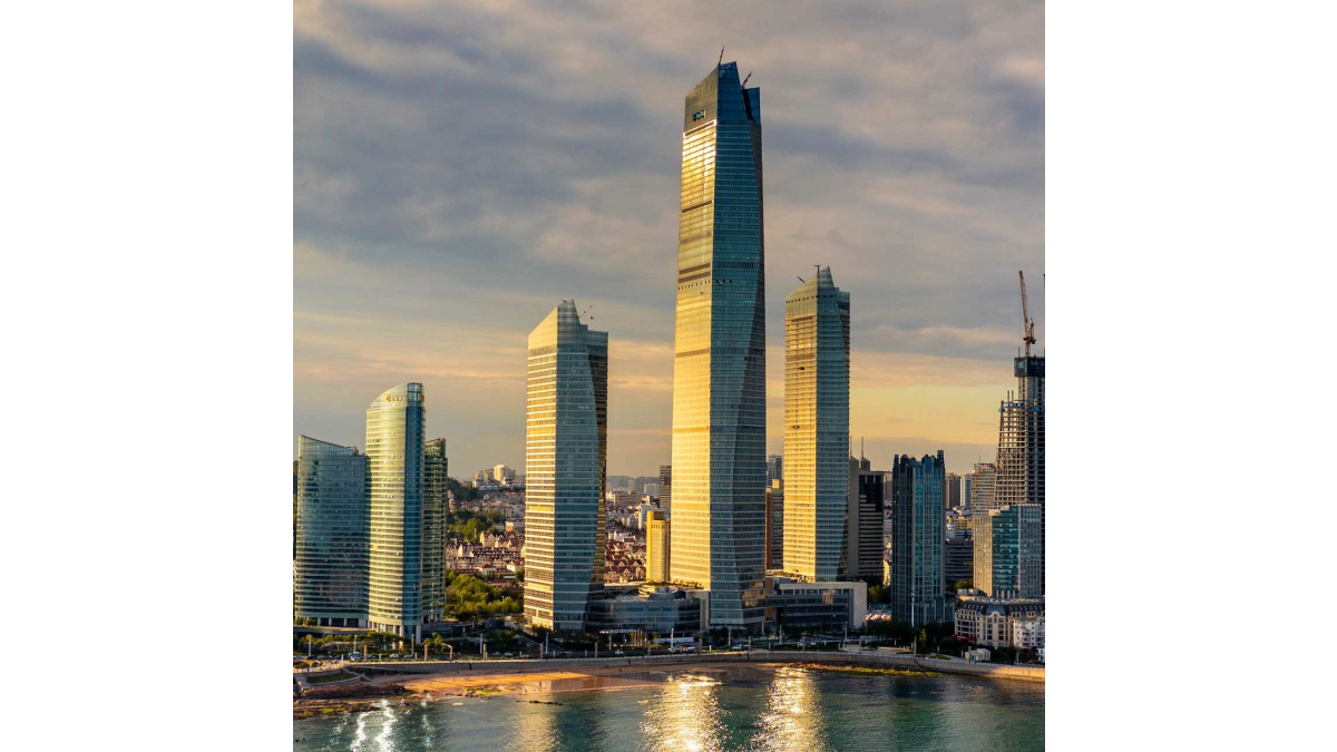 Image 1: Qingdao Hai Tian Center, Qingdao, Shandong Province, China, designed by Archilier Architecture. The mixed-use development includes high-rise residential accommodation alongside hotel, office and retail uses. The facade incorporates Technoform thermal insulating strips within the aluminium framing and Technoform warm-edge spacers within the insulating glass units, reducing thermal bridging through the frame and glass edge.